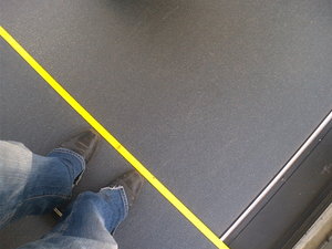 stand behind the yellow line